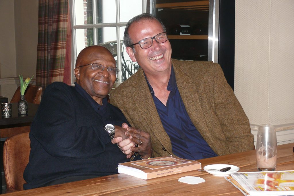Dr Jacob Meiring shaking hands with Desmond Tutu